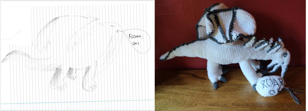 A line drawing of a white dragon like creature outlined in grey with the words "Roar Ok!". The crochet toy is on the right and has a speech bubble with the words in it