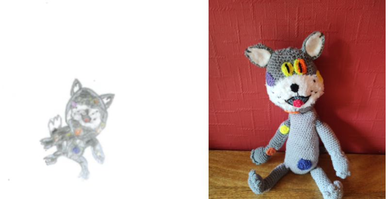 A very small drawing of a little grey cat. On the right is the crochet toy showing his white muzzle, ears and coloured patches here and there on his body. He has yellow eyes with vertical pupils