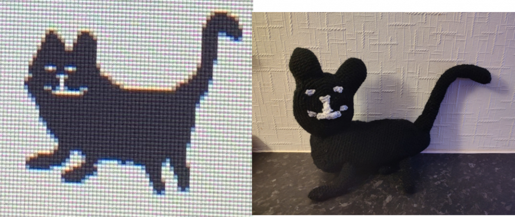 A drawing of a black cat with a happy white smile and eyes, with the crochet toy version on the right.