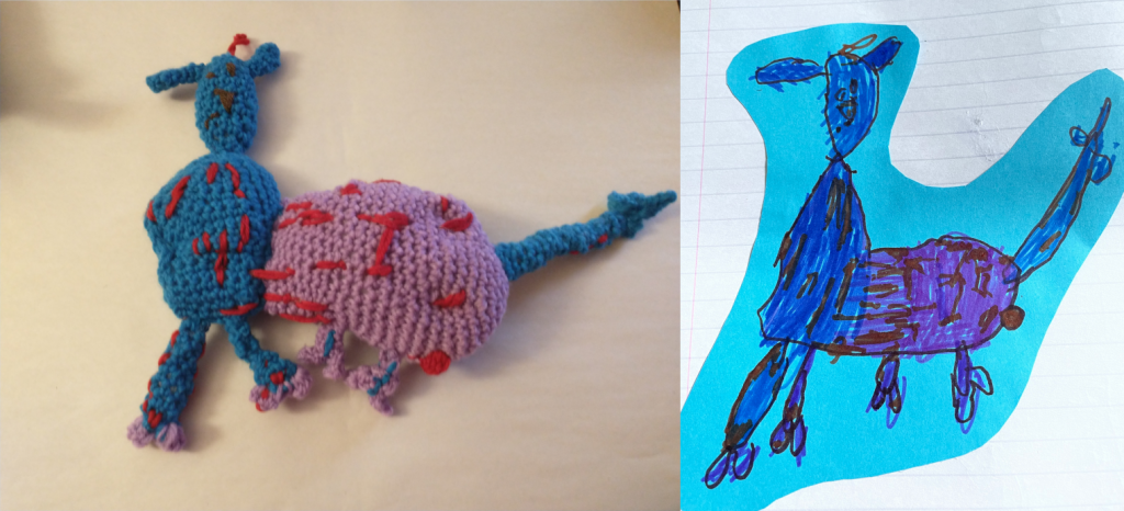 A crochet animal next to a child's drawing of the same. The "steed" has a small blue face with a flat black upturned triangle nose and small black eyes. The half of the body leading down from the neck is blue. The back half of the body is purple. It has a blue tail and the body is covered with red splotches and lines.
