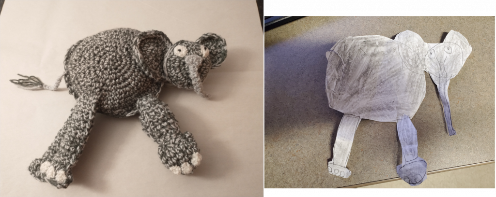 A photo of a crochet elephant on the left and a cut out of a child's drawing of an elephant on the right. The elephant has a flat, round, grey body and two legs. He has a small round face, with two big, round ears and a tail with a bush on it.