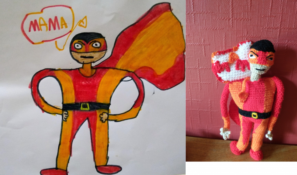 A drawing of a stern looking superhero with a striped orange and red costume and cape. The speech bubble says Super Mama. The crochet toy on the right has the speech bubble on its shoulder