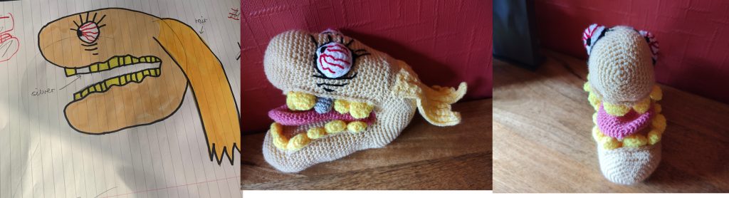 A picture of a yellow ball head with bloodshot eyes and hair flowing behind it. The crochet version is shown on the left in profile and then again from the front, showing the yellow teeth and pink tongue